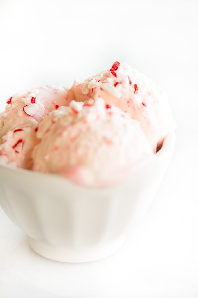 Three scoops of peppermint ice cream in a white bowl