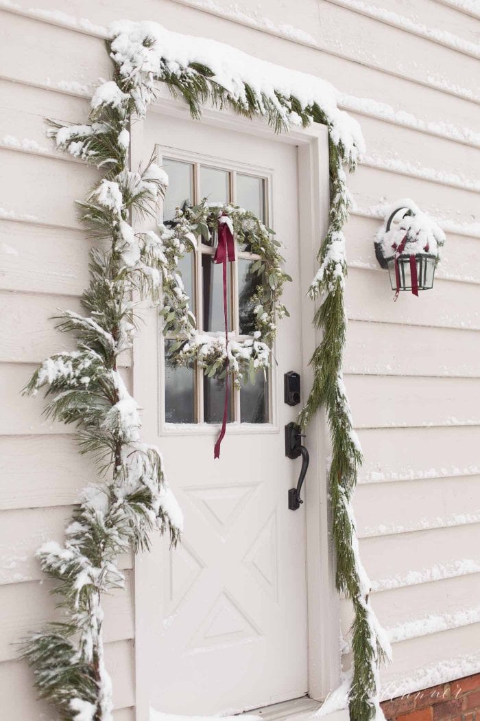 christmas door decorations covered in snow