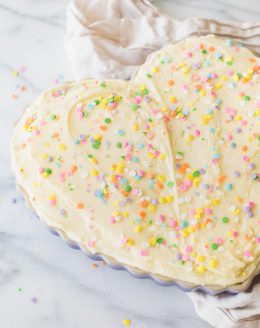 thick chewy frosted sugar cookie cake with buttercream icing and sprinkles