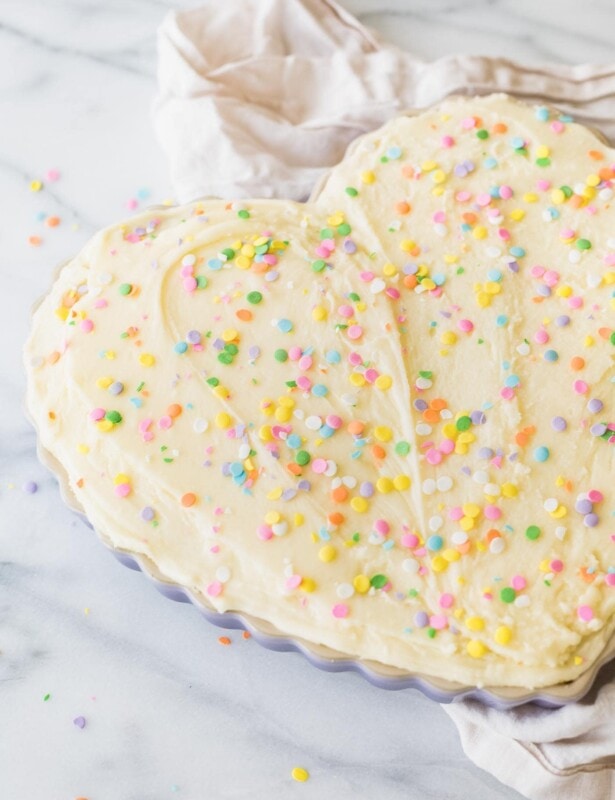 thick chewy frosted sugar cookie cake with buttercream icing and sprinkles