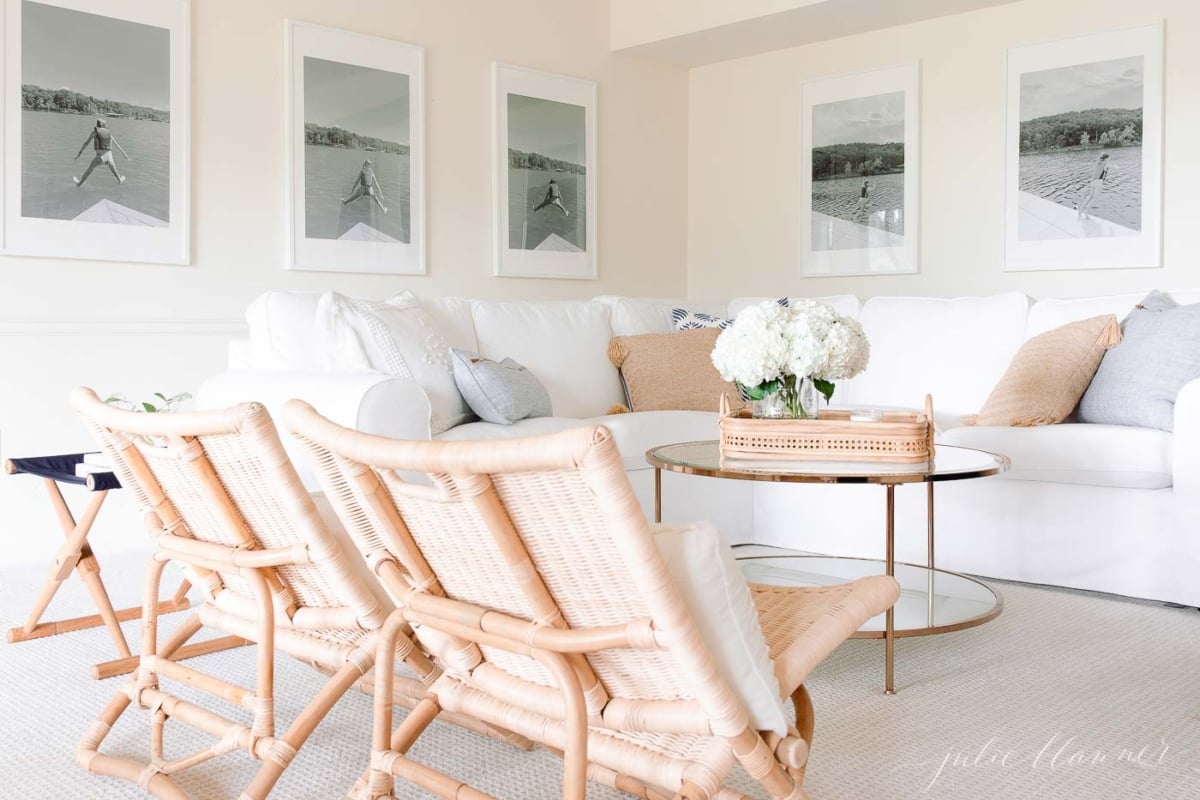 A white couch in a living room, with Farrow and Ball White Tie paint color on the walls.