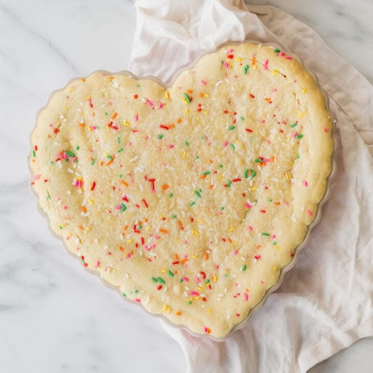This easy birthday cake recipe feels festive without a lot of effort. Funfetti cookie cake is always a crowd pleaser and made with just staple ingredients!