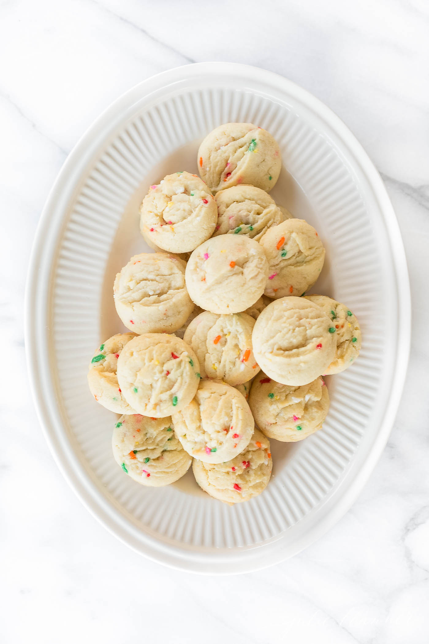 The best funfetti cookies on a white platter