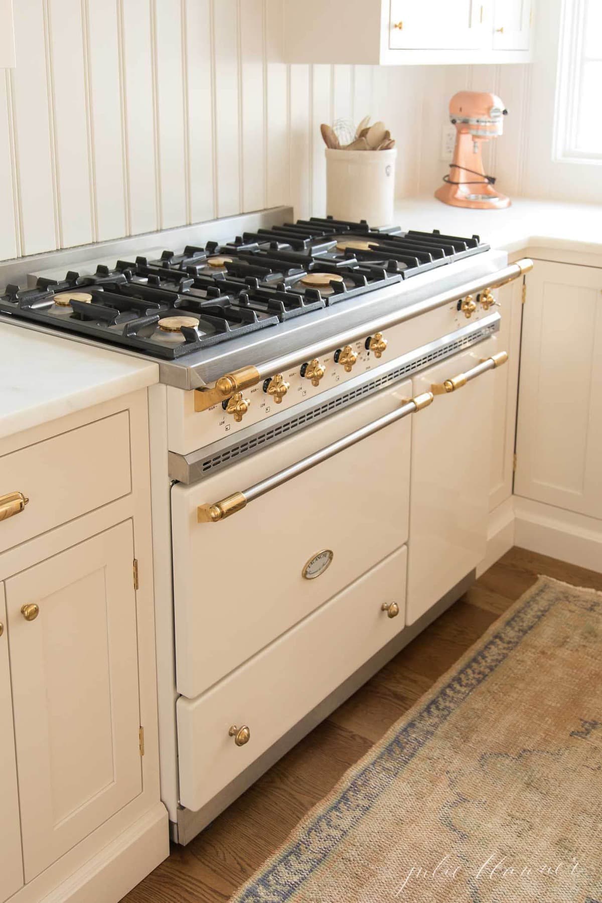 Stove and cooker red hot. Induction, ceramic cooktop, electric stovetop and  hob in kitchen. Warm plate ready for cooking. Contemporary interior design,  modern counter and wood table., Stock image