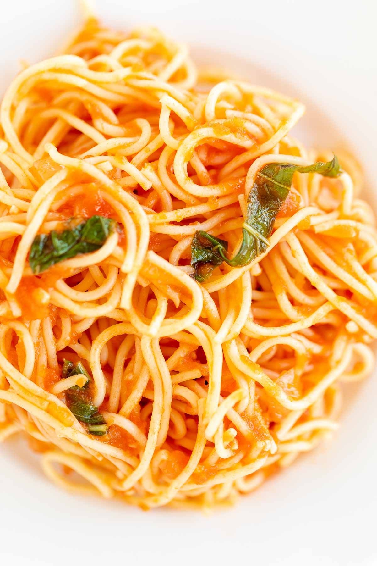A plate of spaghetti in pomodoro sauce.