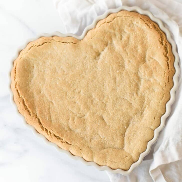peanut butter cookie cake in heart shaped dish
