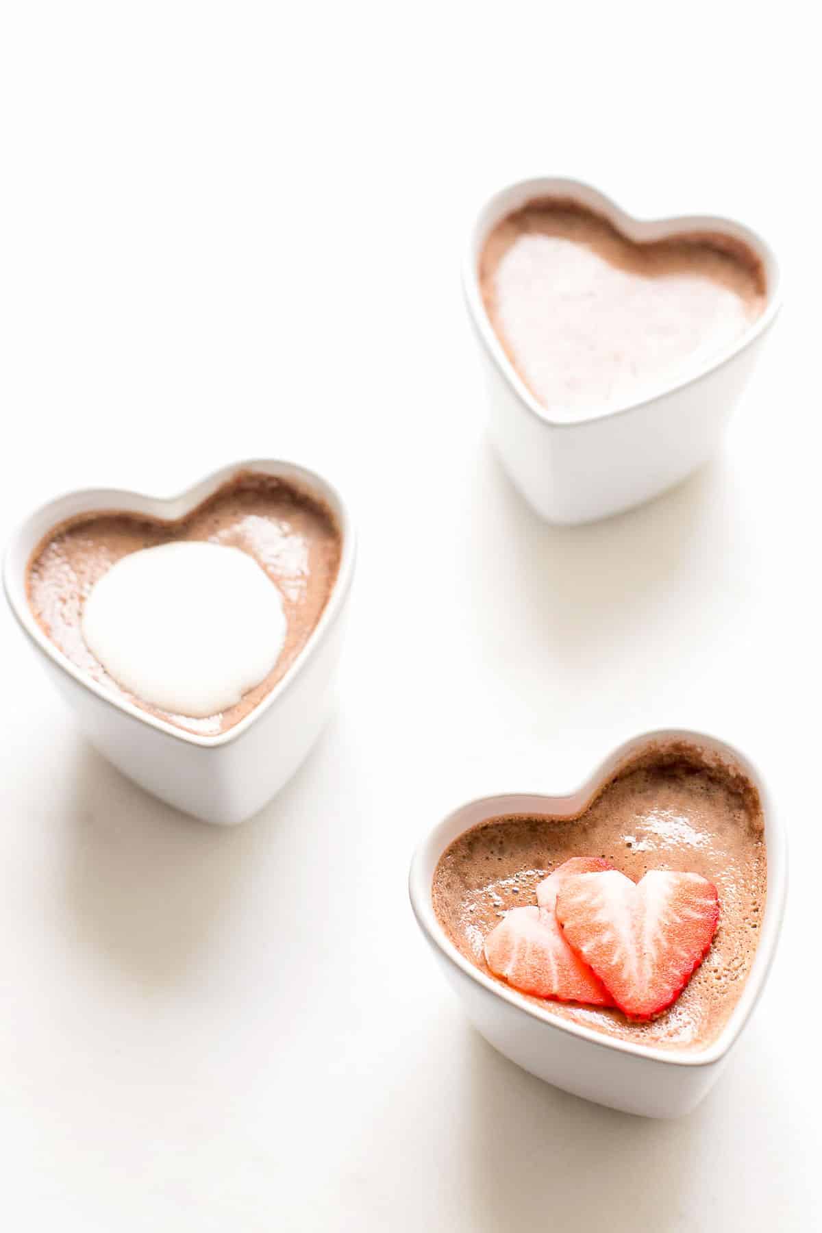 3 chocolate pots de crème in heart shaped ramekins for a beautiful valentine's day recipe