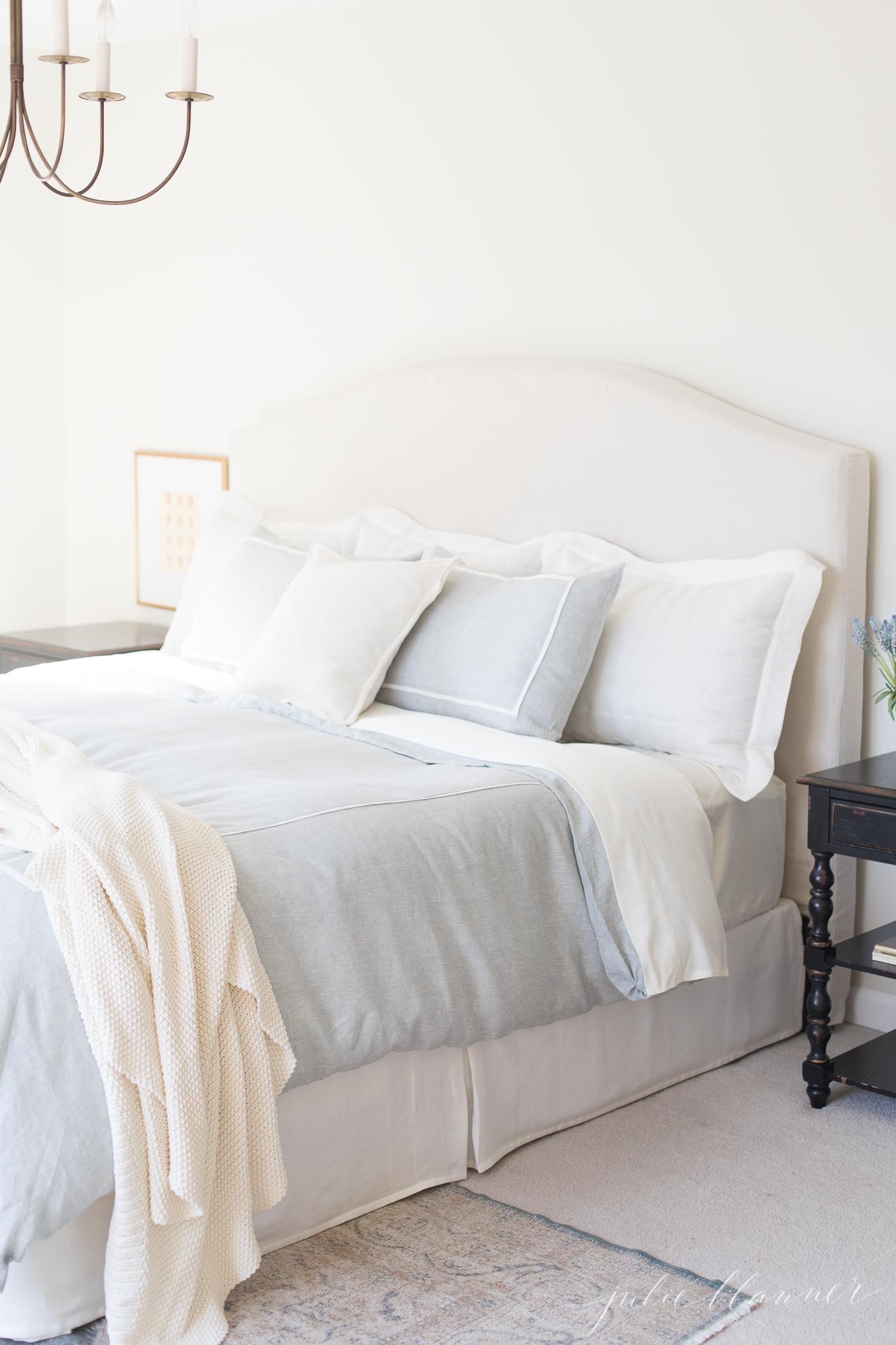 cream bedroom blue bedding brass light