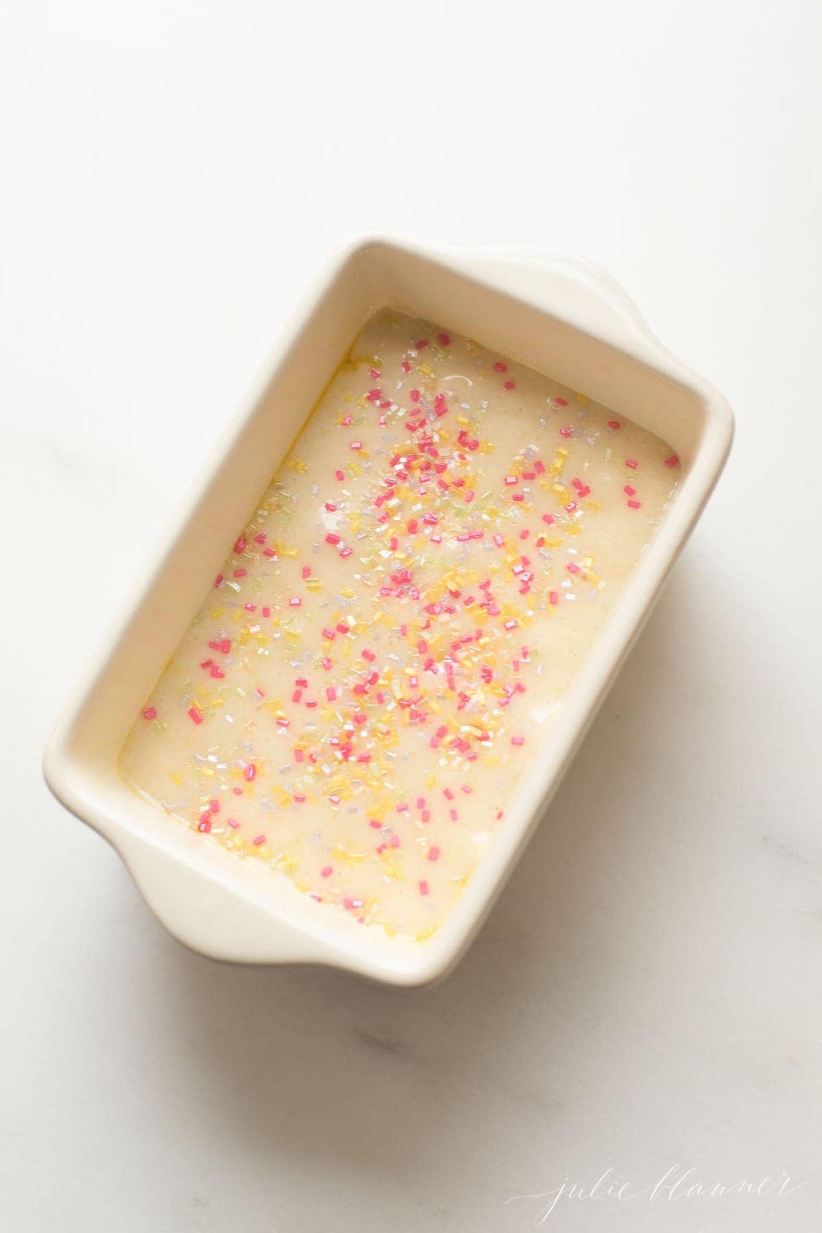 funfetti bread recipe unbaked in a small white loaf pan