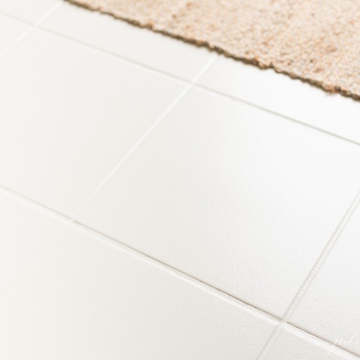 painted tile with neutral jute rug