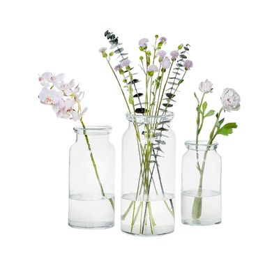 a trio of small handblown glass flower vases