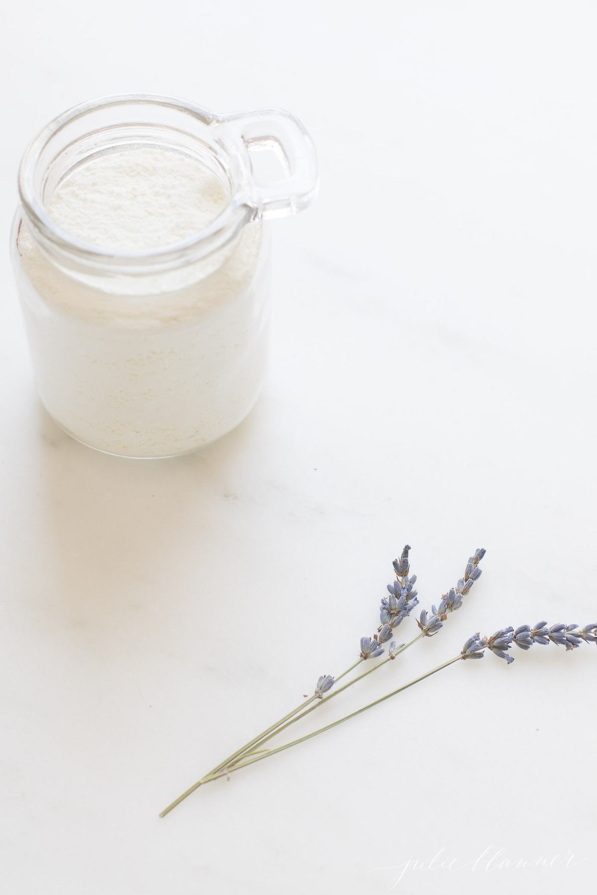 milk bath in glass jar by lavender