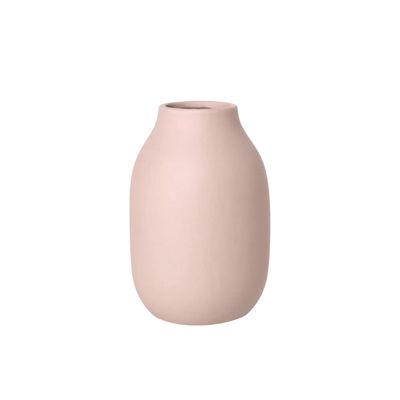 A blush pink flower vase on a white background.