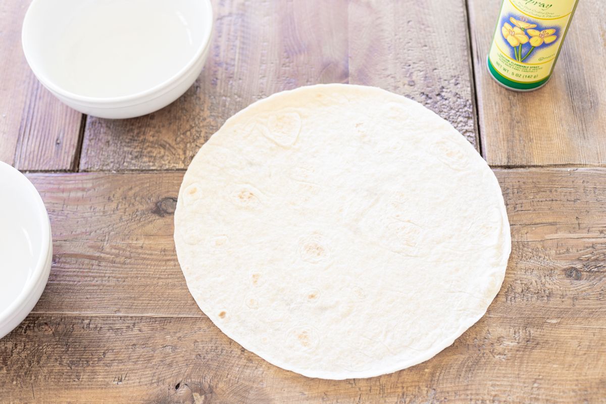 A tortilla on a wooden table.