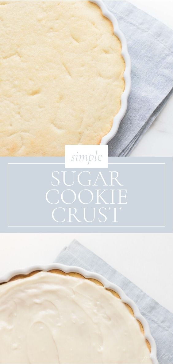 A sugar cookie and plain crust is pictured in a white baking dish on a marble counter top next to a grey napkin.