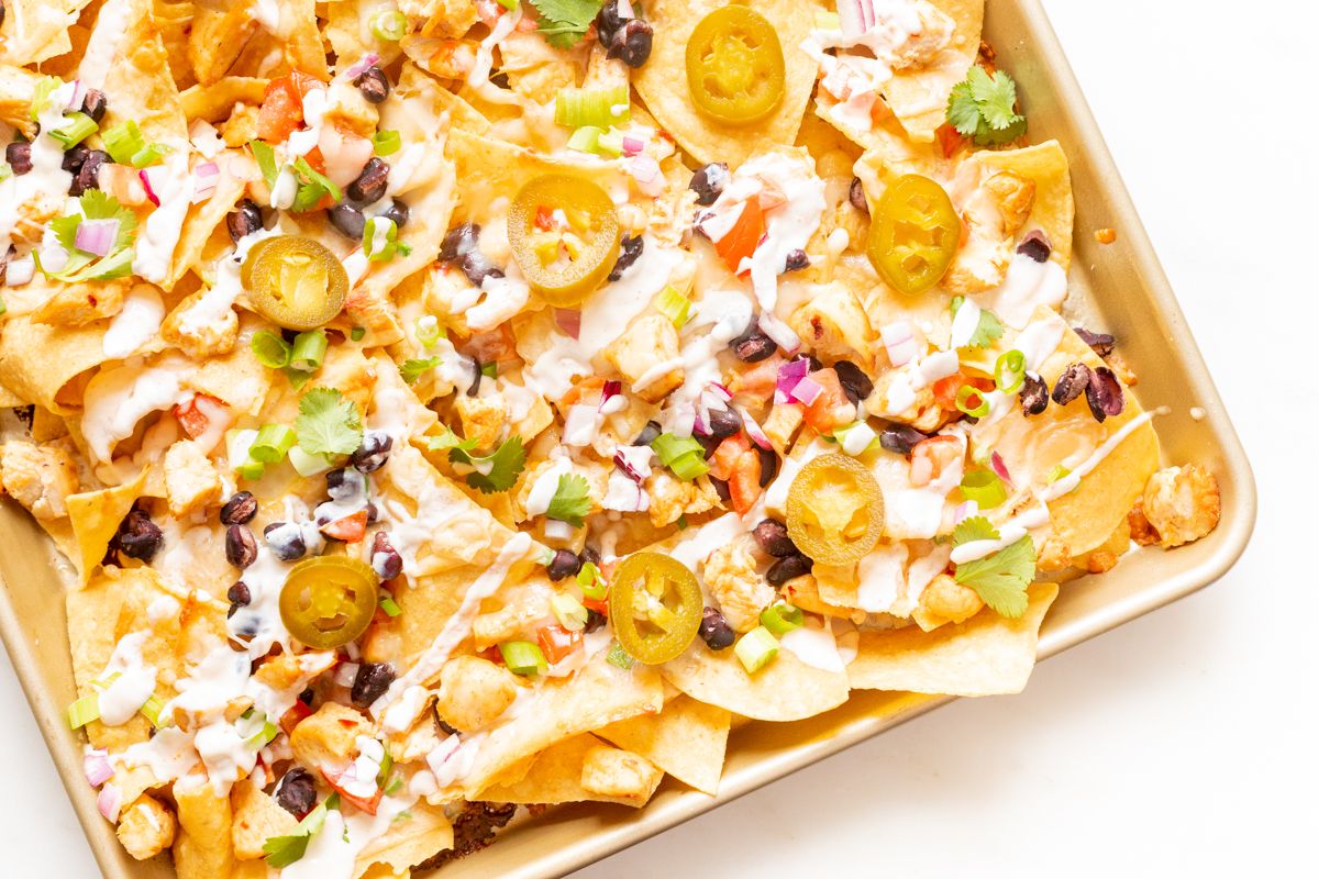 Chicken nachos on a sheet pan. 