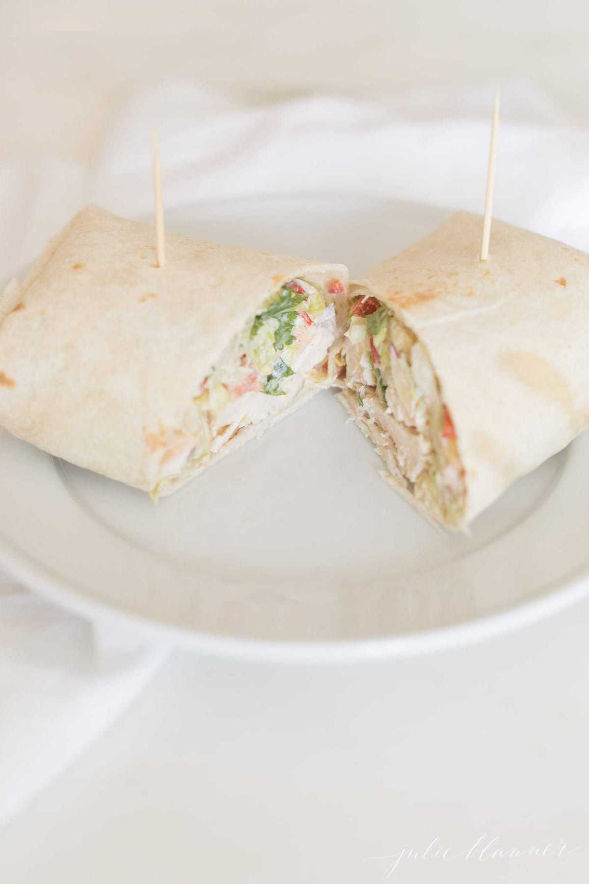 fiesta chicken wrap cut in half on a plate