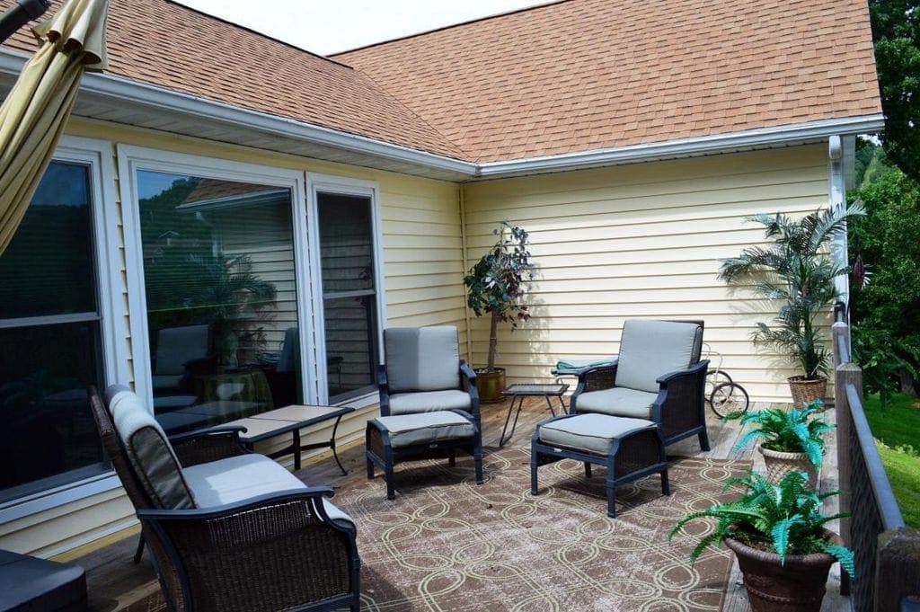 A back porch before being remodeled; yellow, brown, and gray accents. 