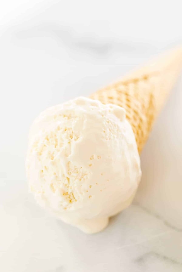 creamy ice cream in a cone on mrble surface