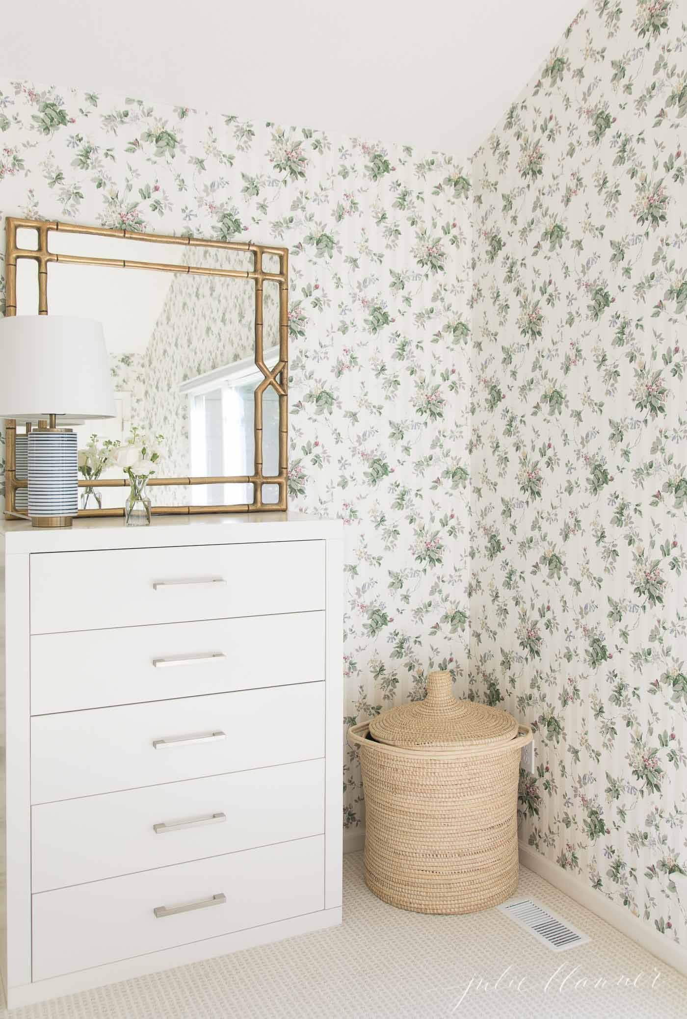 patterned carpet and floral wallpaper in a bedroom