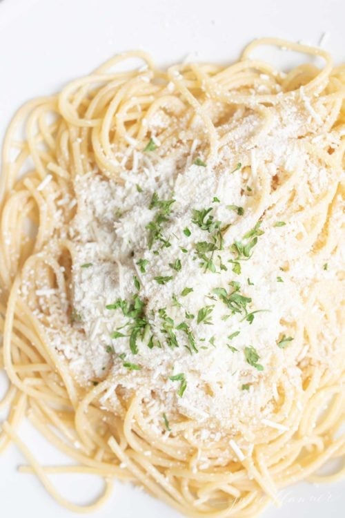 A plate of spaghetti with mizithra cheese and brown butter.