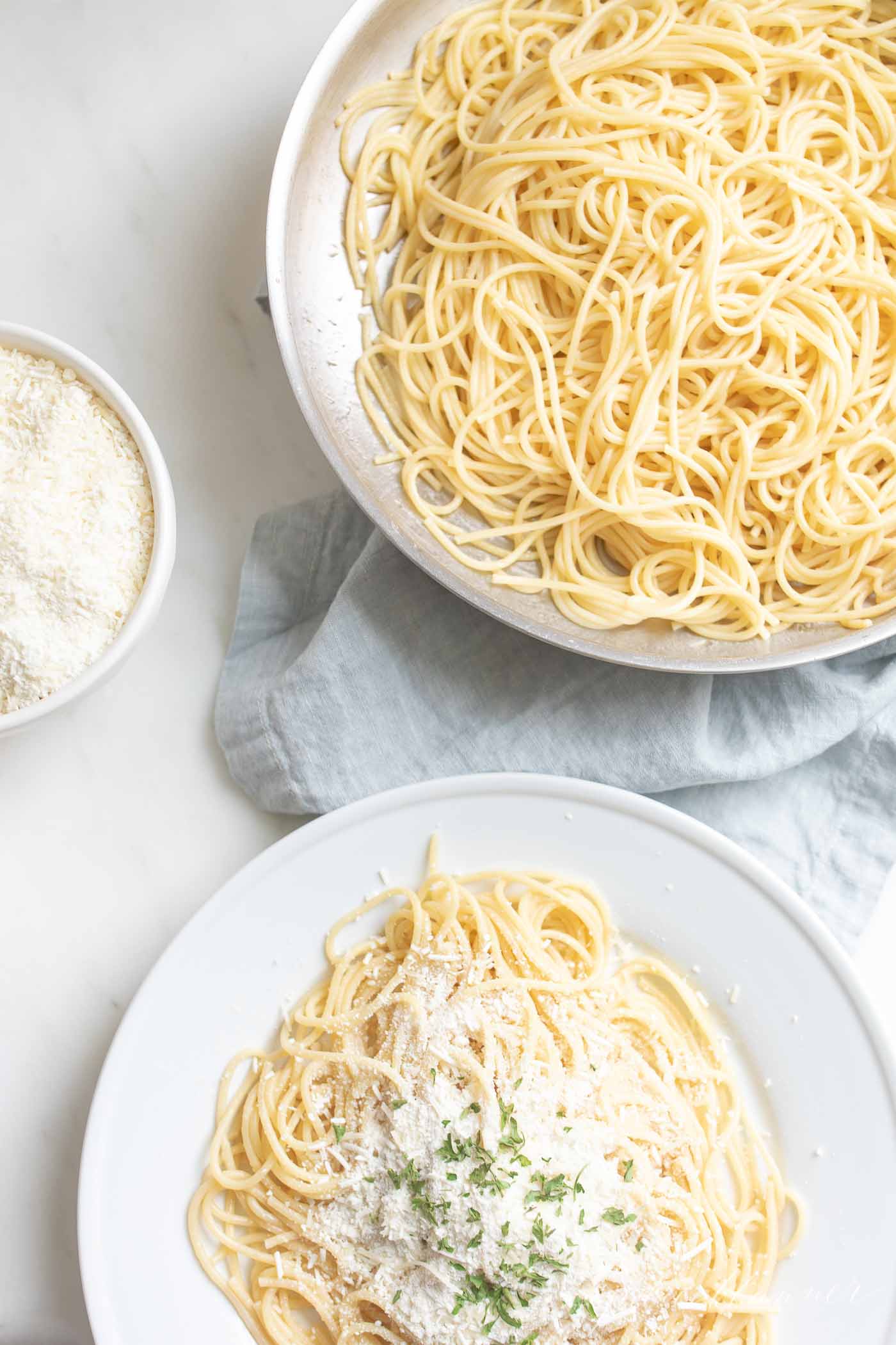spaghetti with mizithra cheese browned butter and mizithra cheese in a bowl