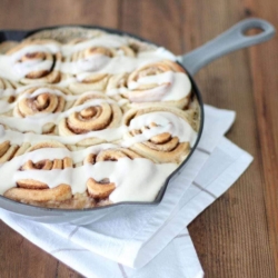 Homemade cinnamon rolls in a cast iron skillet