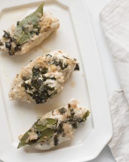 chicken in white wine sauce on platter