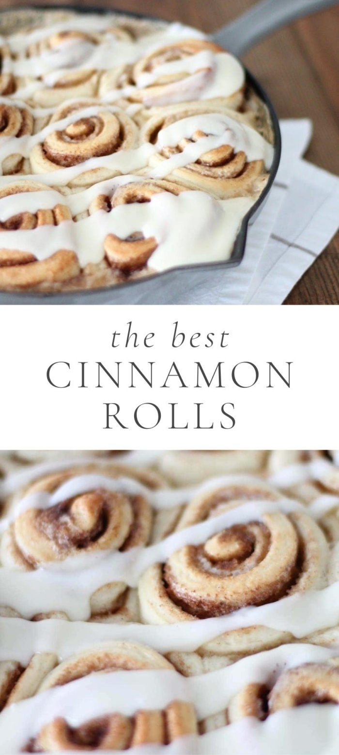cinnamon rolls and icing in black pan next to white napkins