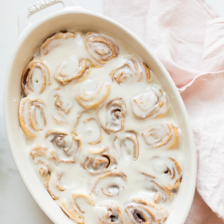 easy cinnamon rolls in an oval white baking dish