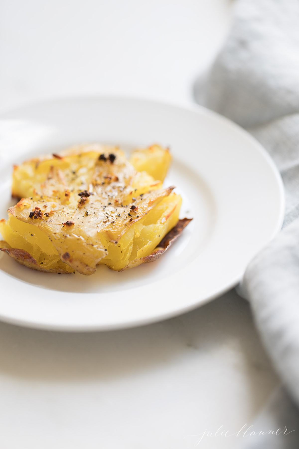 garlic smashed potatoes on plate