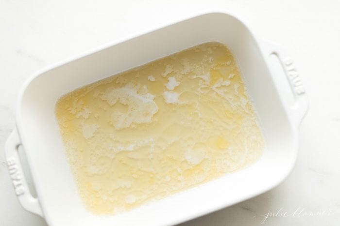 melted butter in 9x13 casserole dish