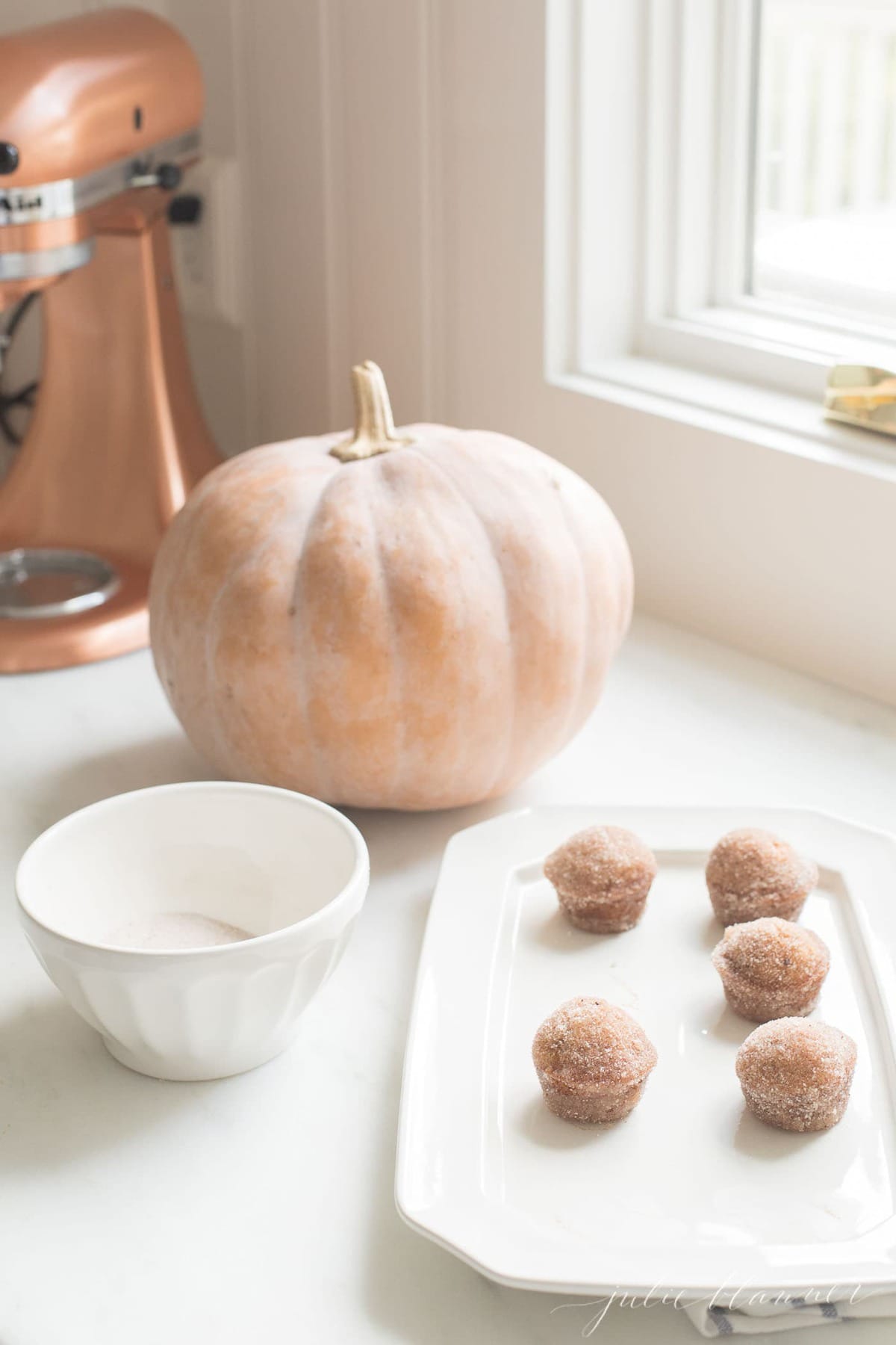pumpkin muffins on a kitchen worktop