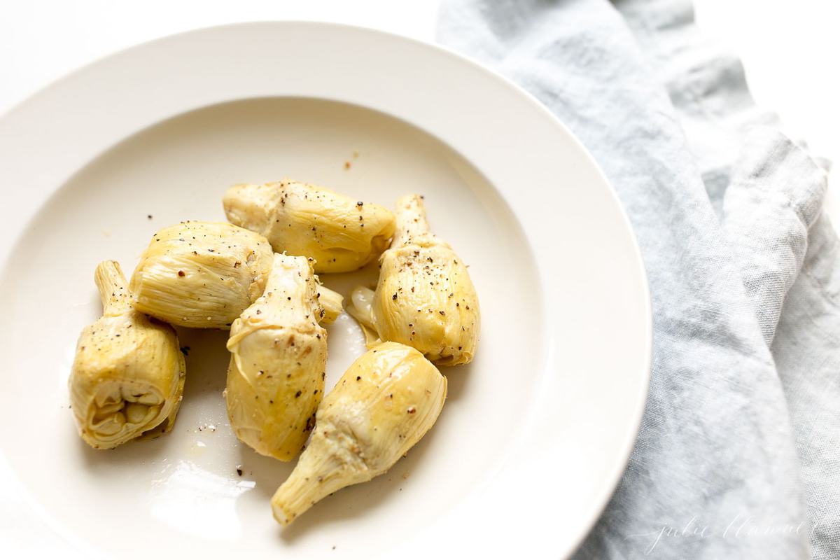 roasted artichokes on a white plate