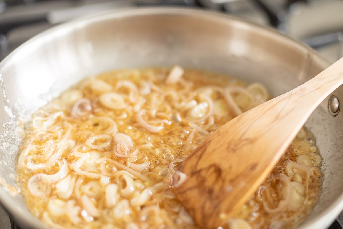 Shallots in a pant, being caramelized