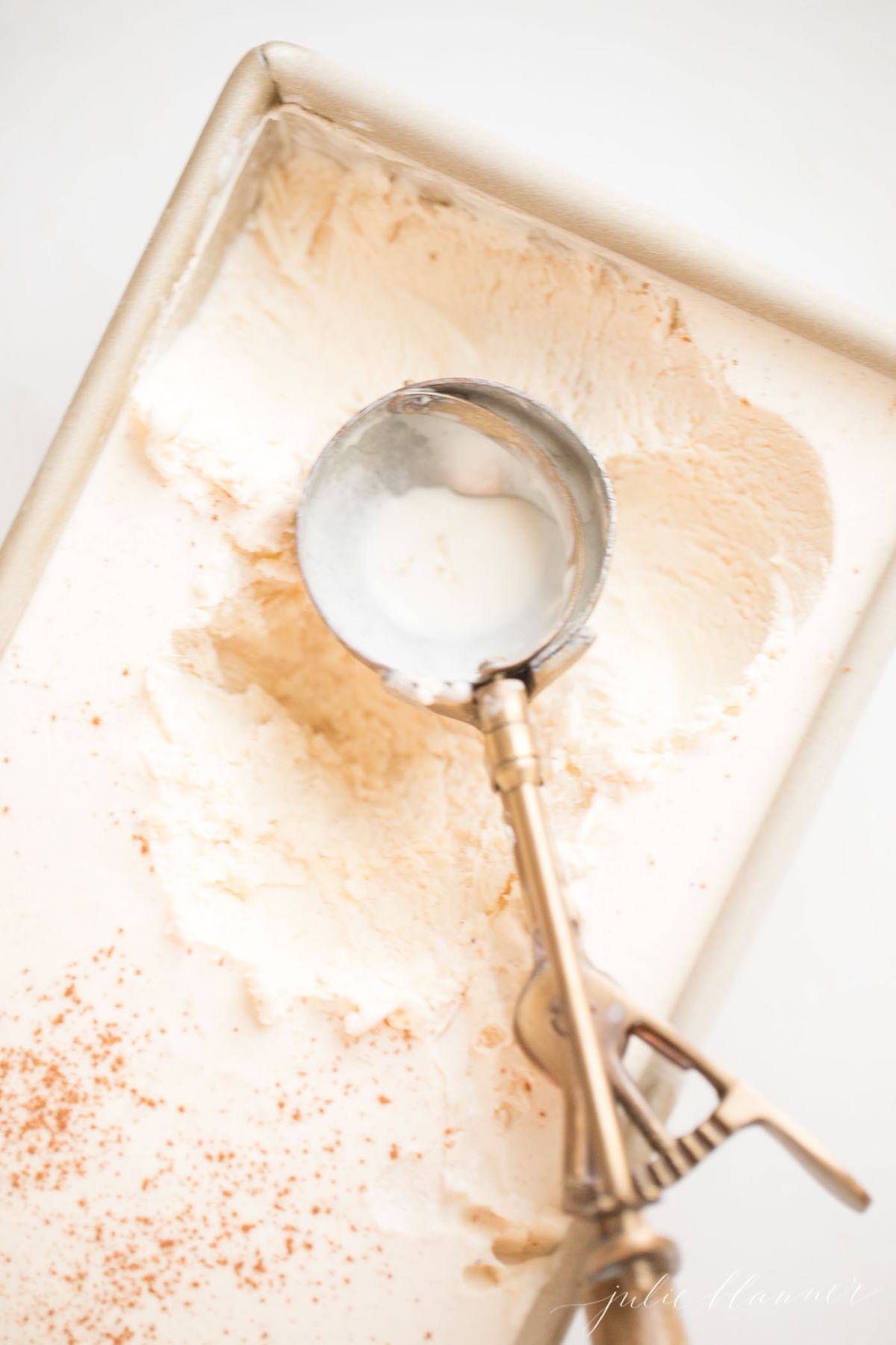 Easy EGGNOG Ice Cream Recipe | embrace the flavors of the season with everyone's favorite drink in ice cream form! It's the ultimate Christmas dessert recipe! #dessert #christmas #christmasrecipe #easyrecipe #icecream An icecream scoop