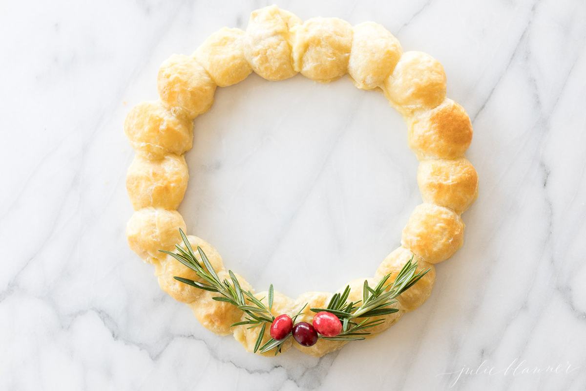 baked brie in puff pastry made into a wreath