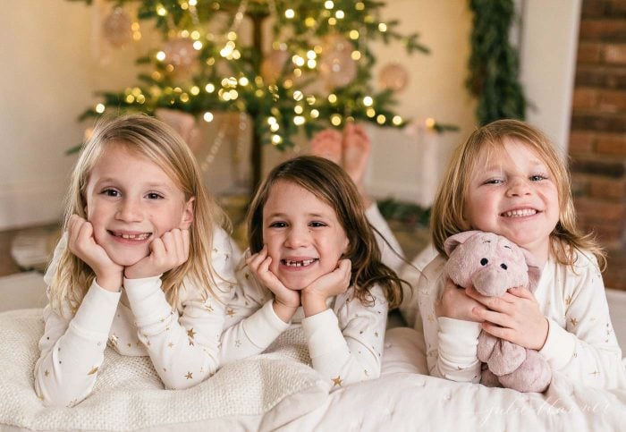 girls in front of christmas tree