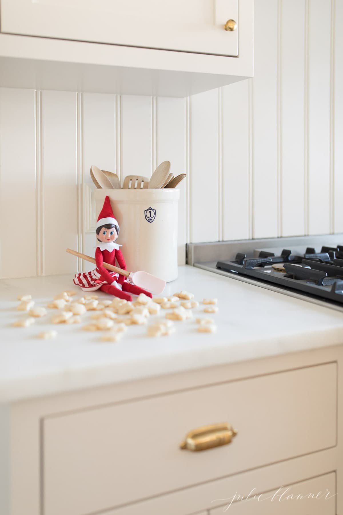 ELF COOKIES are the perfect treat for your elf on the shelf to give your children or for them to bake your elf. Get the easy recipe using just staple ingredients! #elfontheshelf #christmas #christmascookies #cookies #easyrecipe #recipes Mini cookies in front of a elf on the shelf