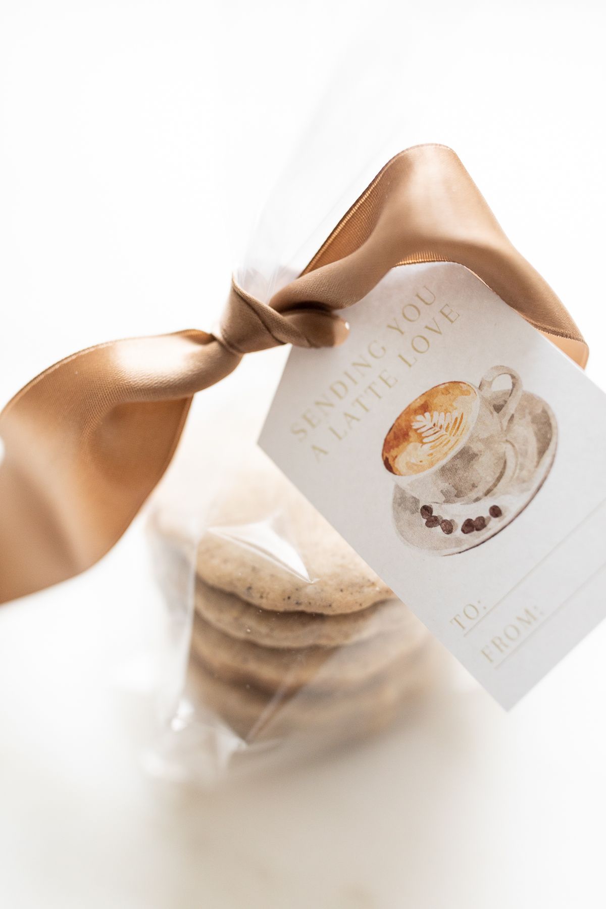 Shortbread Espresso cookies stacked in a clear bag with a tag that reads "thanks a latte"
