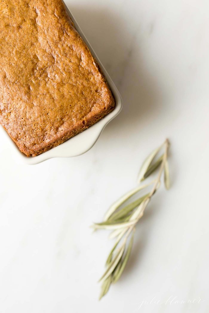 The baked bread in a white dish