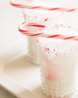 cocktail with peppermint schnapps garnished with candy cane