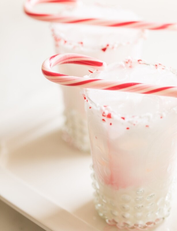 cocktail with peppermint schnapps garnished with candy cane