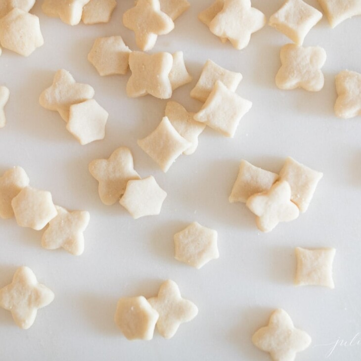 bit sized elf cookies in various shapes on white surface