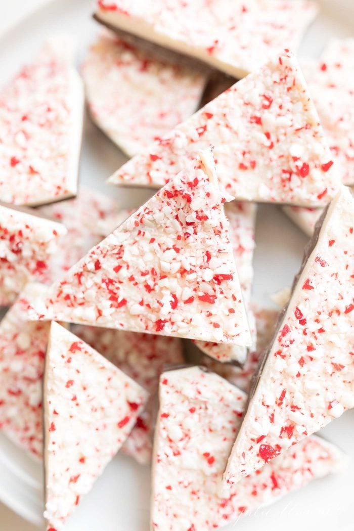 Salted Peppermint Bark | a new twist on the classic Christmas candy! #christmas #candy #gift #easyrecipe salted peppermint bark stacked on a white plate