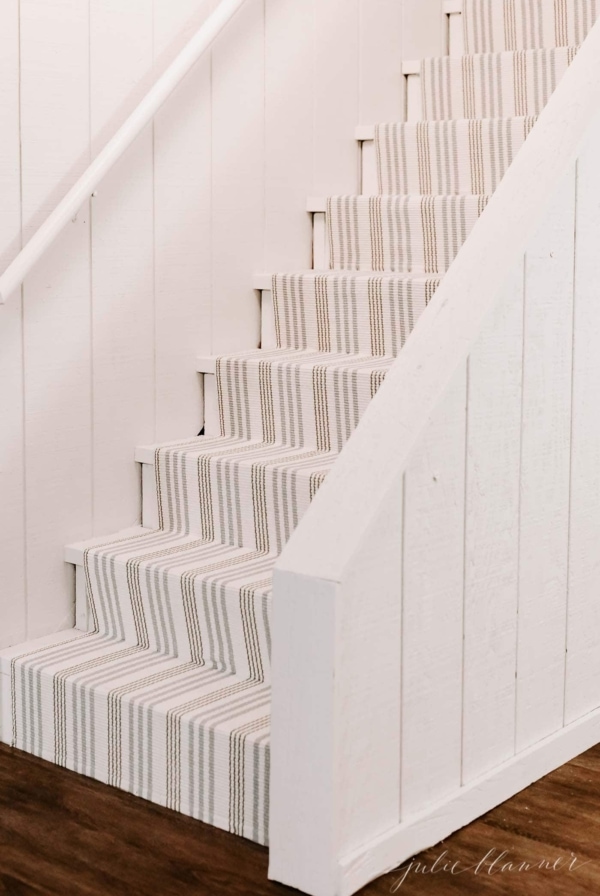 farrow and ball clunch paint on basement steps with a striped runner