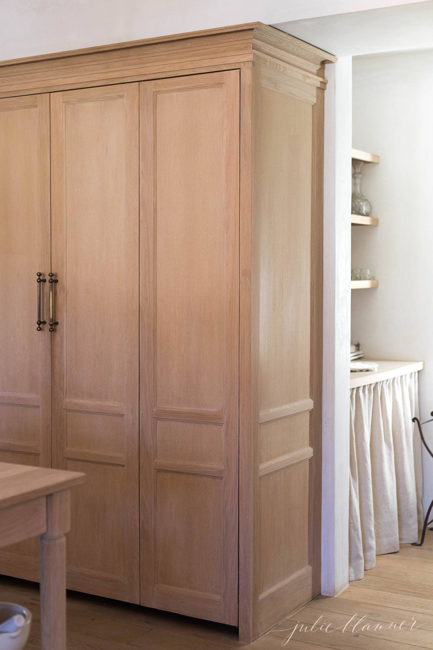 Soft white oak cabinets in a kitchen space in Patina Farm