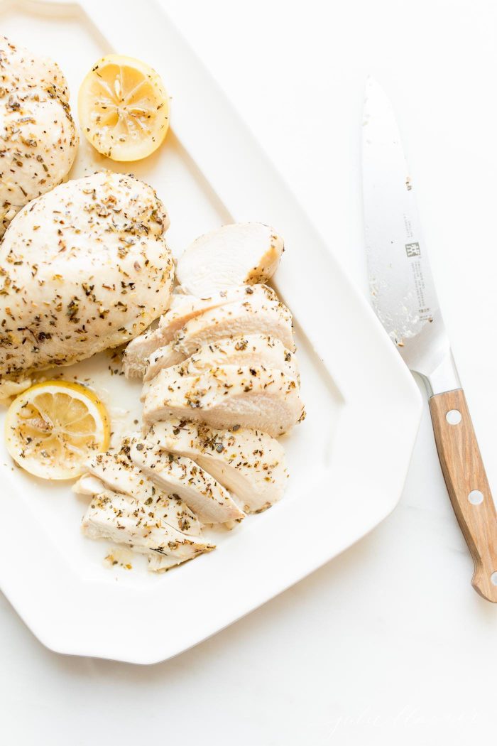 lemon chicken recipe on platter with knife