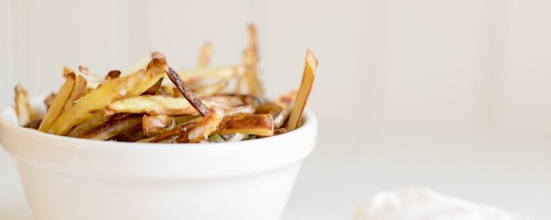 truffle fries in a white bowl