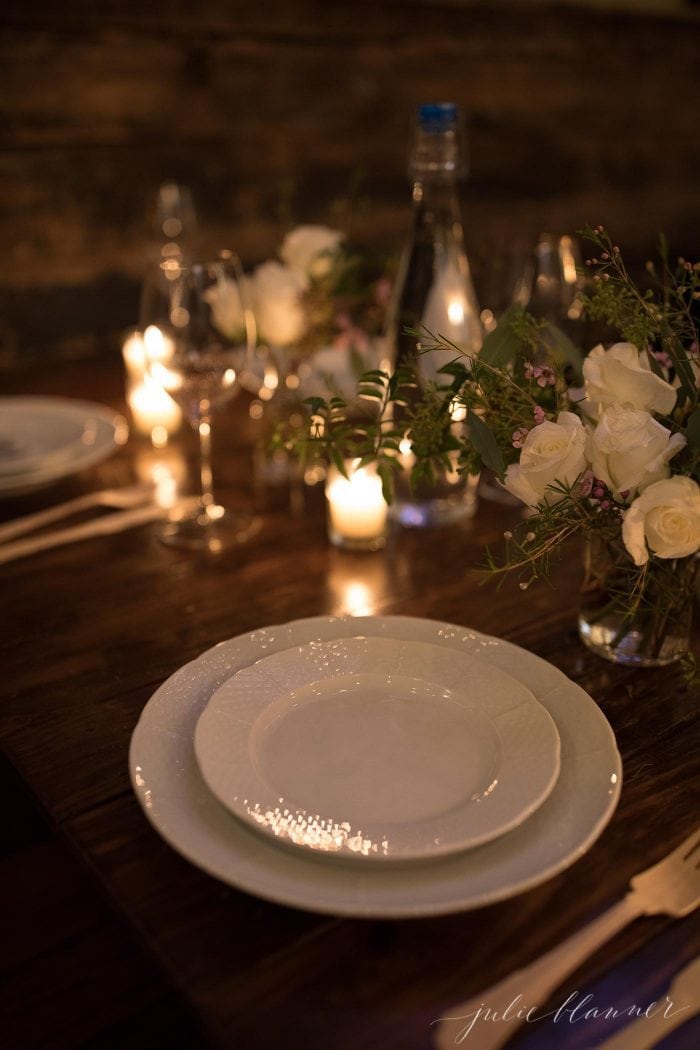 table setting with rose flower arrangements